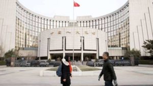 China’s central bank cuts key lending rates, including one for the first time in nearly 2 years